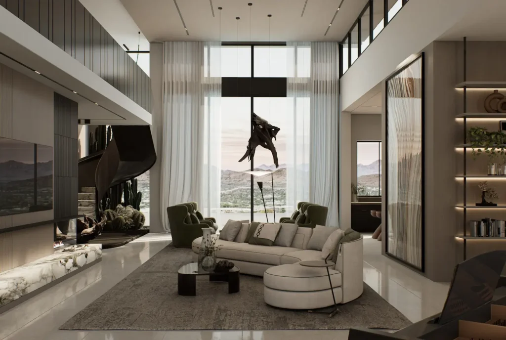 A grand, open-plan living room with double-height ceilings, a curved staircase, a modular cream sofa, and massive windows overlooking a mountain landscape.
