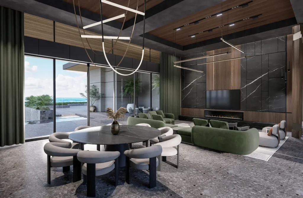 A vast living area with a round black marble dining table, green velvet sofas, and a terrace overlooking the sea.